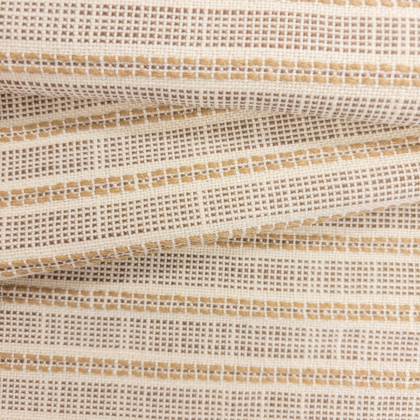 Close-up of Sailor Sisal upholstery fabric in warm neutral tones with a textured woven stripe pattern