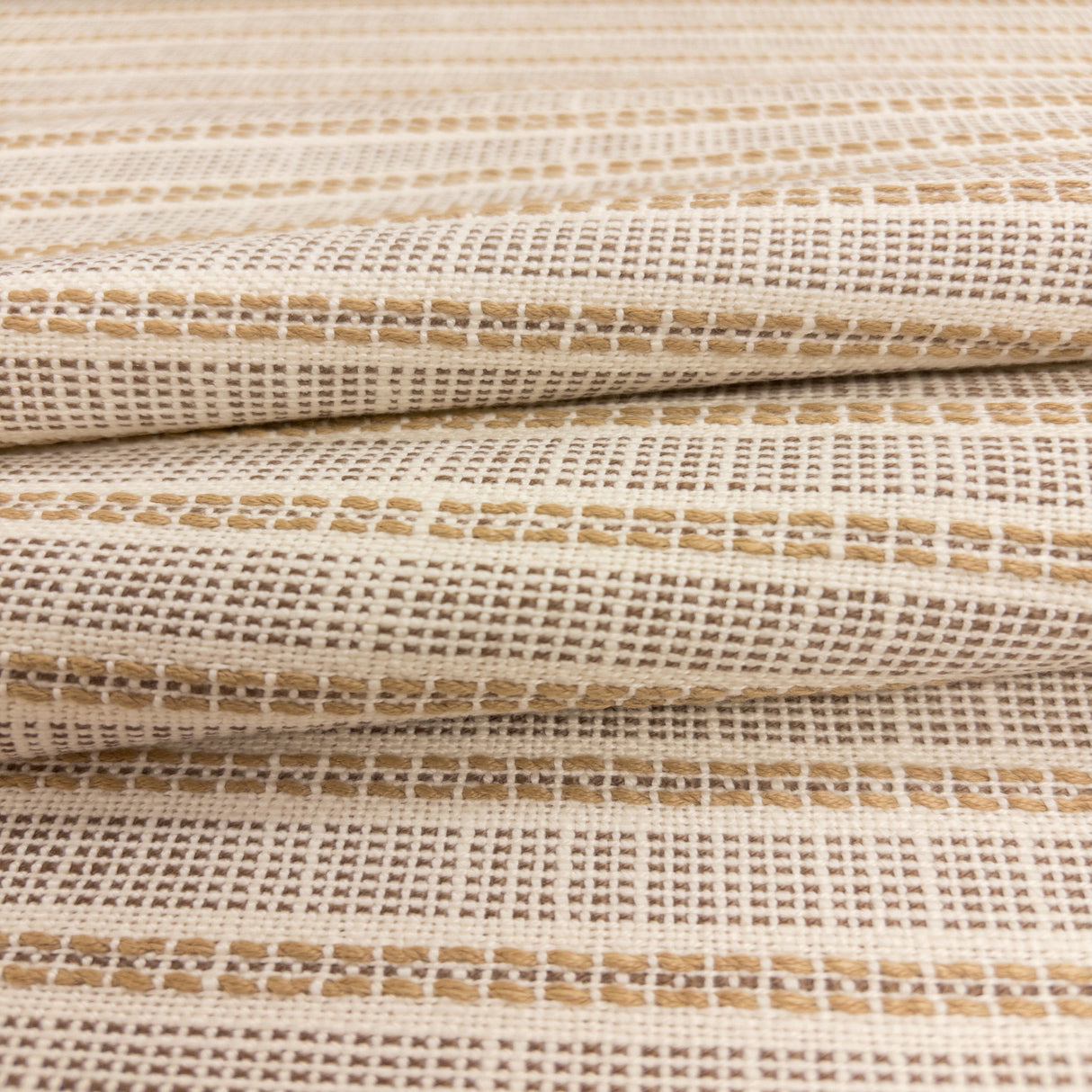 Close-up of Sailor Sisal fabric in warm neutral tones with a textured woven stripe pattern