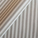 Close-up of Fallon Stripe Ticking Fabric in sand color with horizontal beige and ivory stripes
